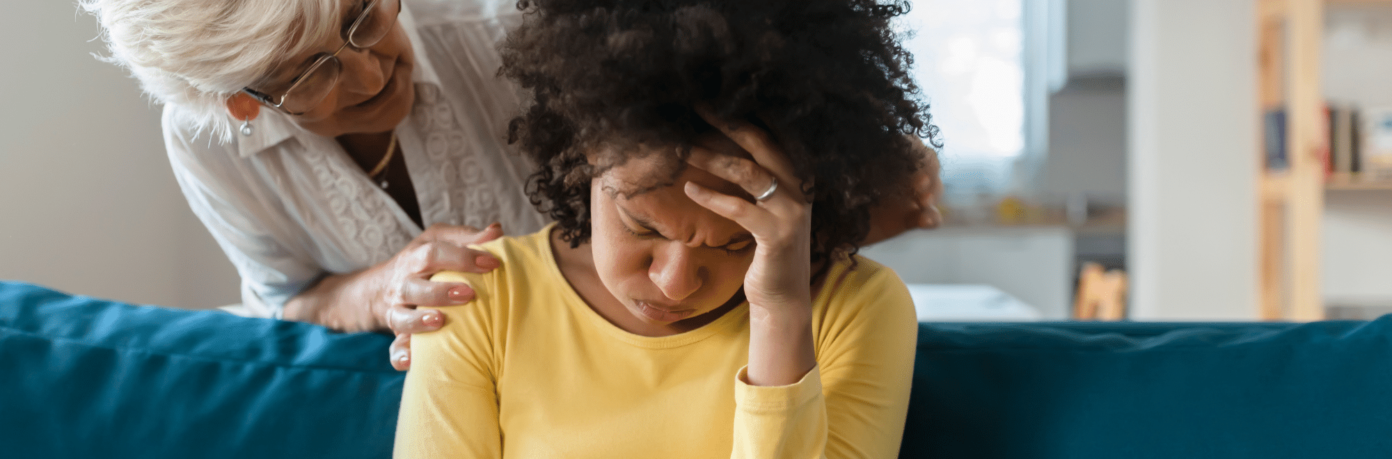 Woman consoling another woman during a moment of grief